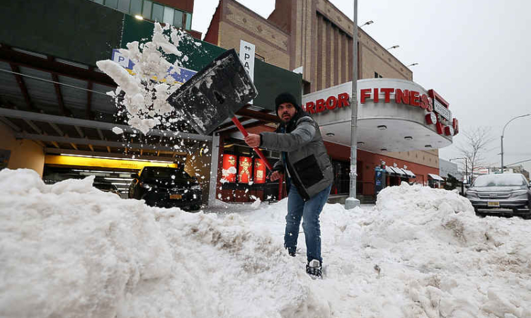 Millions of Americans, digging out after  deadly snowstorm, face days of bitter cold